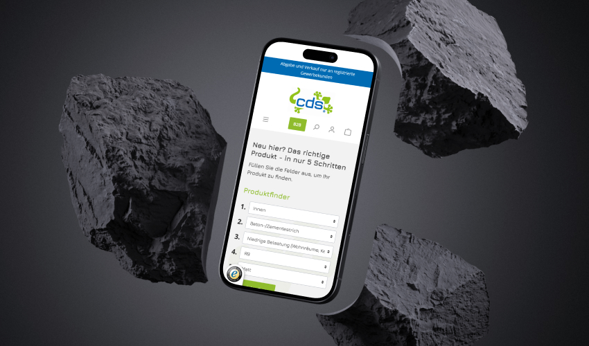 Ein Smartphone ist in einen Hintergrund mit Steinen eingebunden. Auf dem Bildschirm des Smartphones ist der CDS POLYMERE-Shop abgebildet.